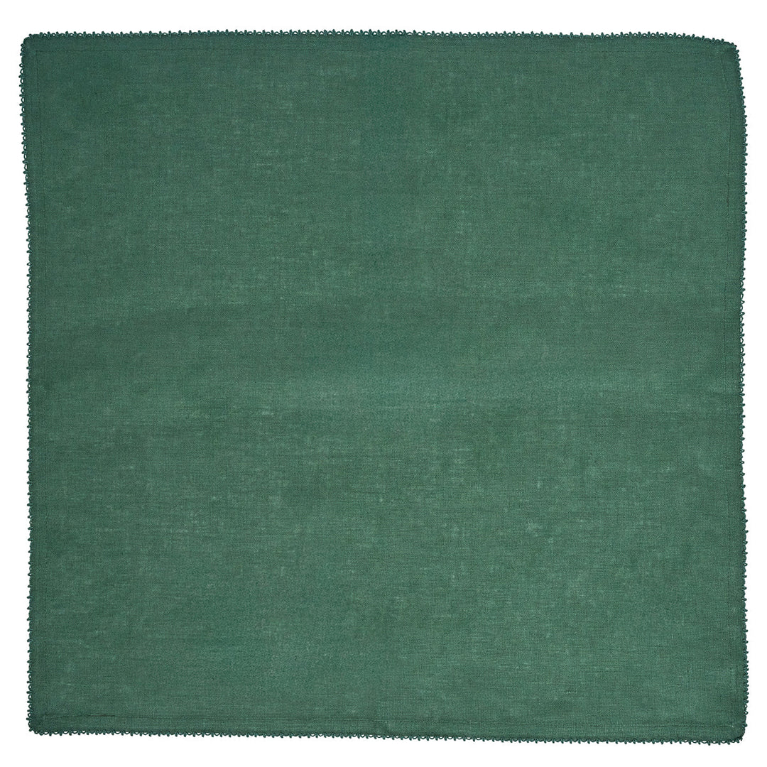 Forest green linen napkin by Juliska featuring a solid evergreen color and delicate decorative trim along the edges.