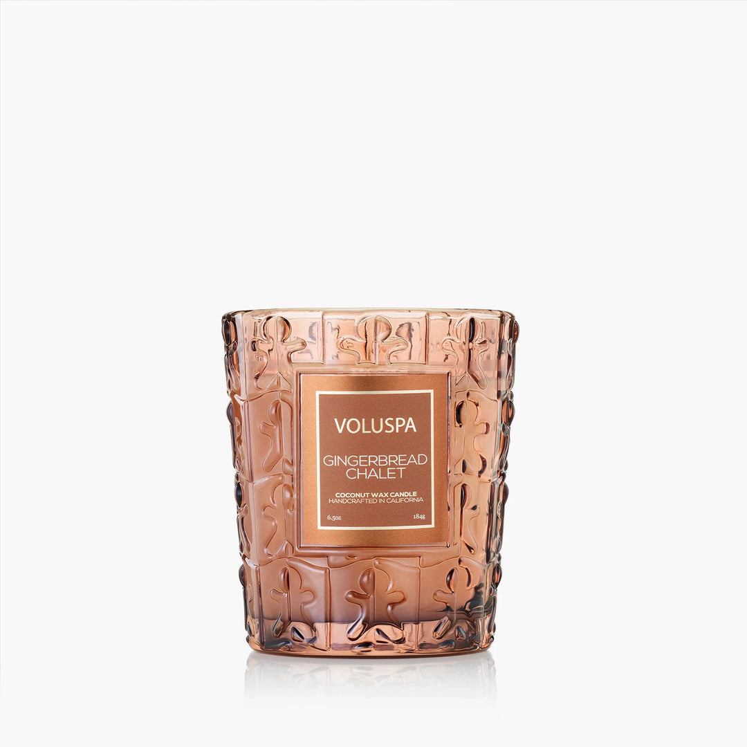 Voluspa Gingerbread Chalet Classic Candle in warm amber embossed glass vessel