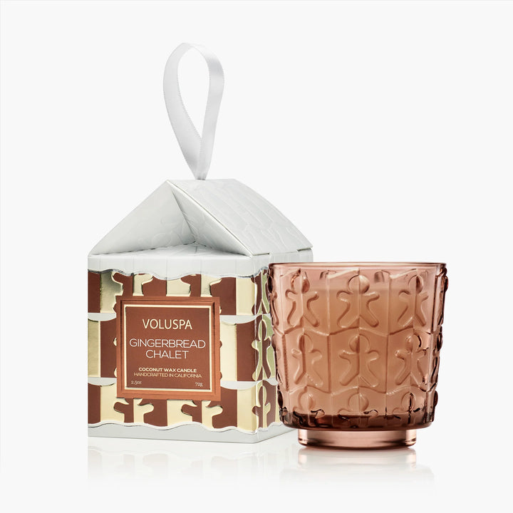Gingerbread Chalet Ornament Pedestal Candle by Voluspa with amber glass vessel and festive chalet gift box