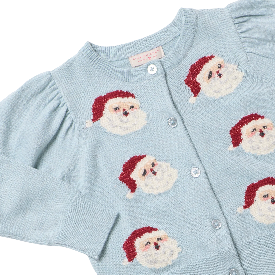 Close-up of Girls Constance Sweater showing knit Santa faces, sparkly buttons, and ribbed neckline