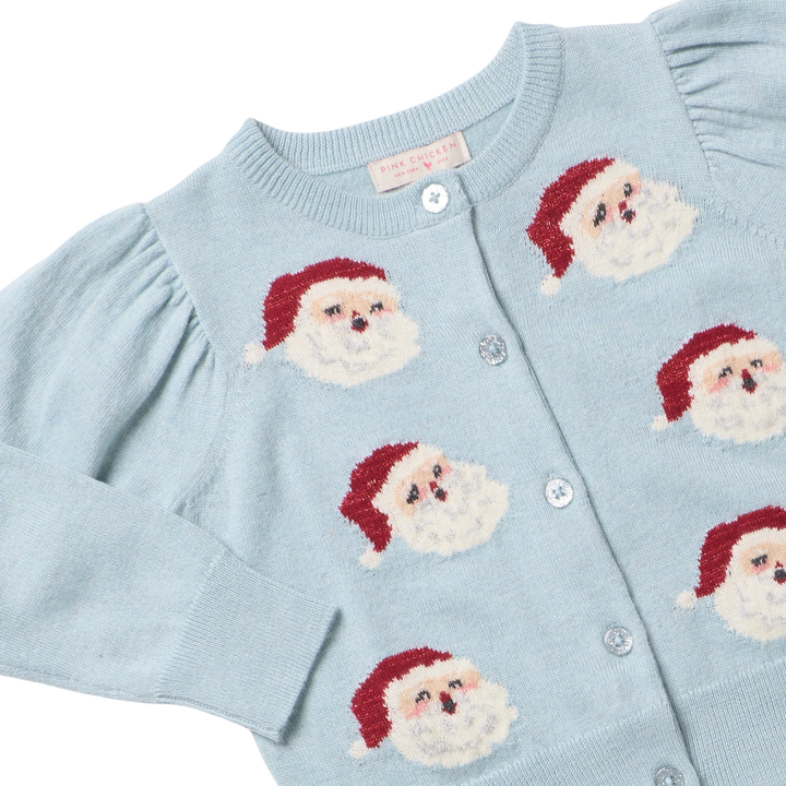 Close-up of Girls Constance Sweater showing knit Santa faces, sparkly buttons, and ribbed neckline
