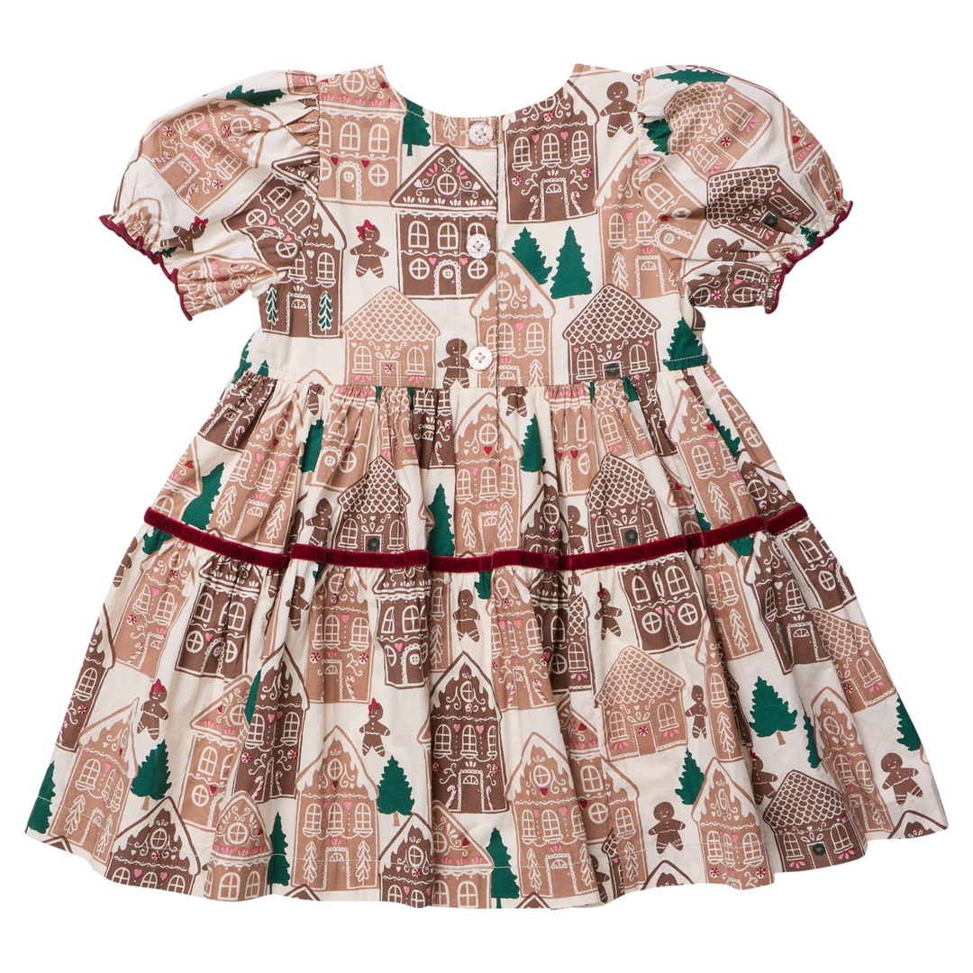 Pink Chicken Girls Eliza Dress in Gingerbread Houses featuring a festive gingerbread house print, puff sleeves, burgundy velvet trim, and tiered skirt.