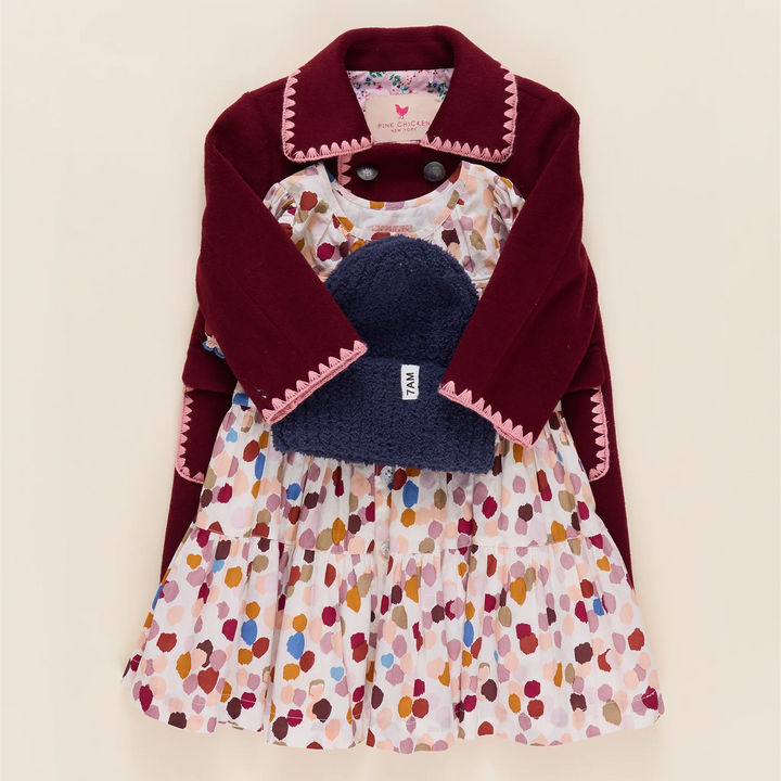 Girls Elizabeth Dress in Autumn Spots styled with burgundy jacket and navy winter accessories