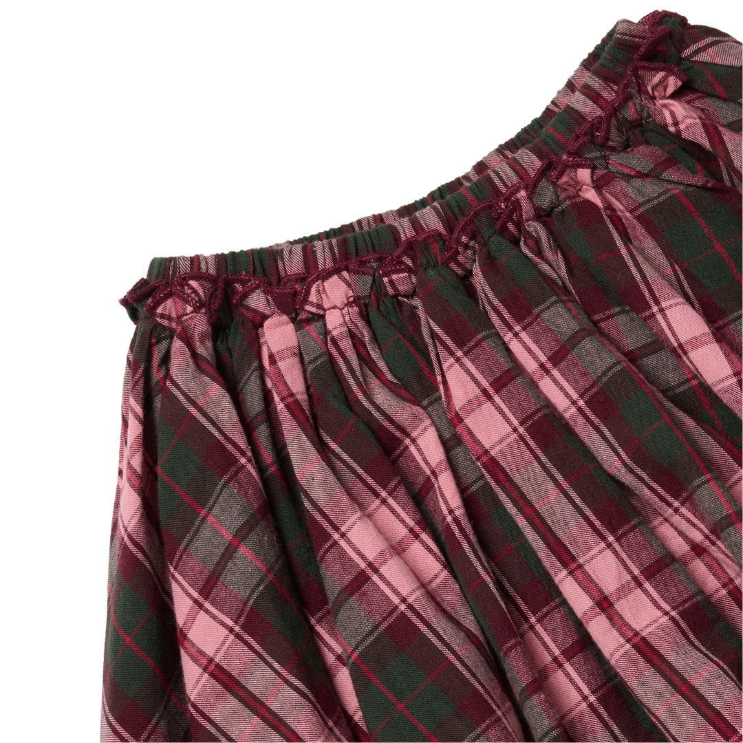 Close-up of the Girls Gianna Skirt in Burgundy Tartan showing the gathered elastic waistband, delicate burgundy ruffle trim, and pink and green plaid pattern.