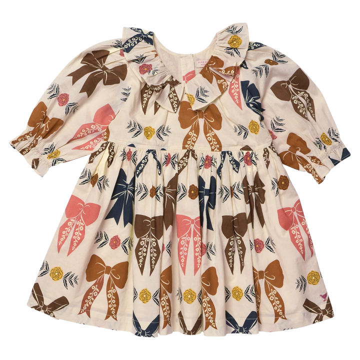 Girls Harvest Bow Dress in cream with colorful brown, pink and navy bows and floral accents