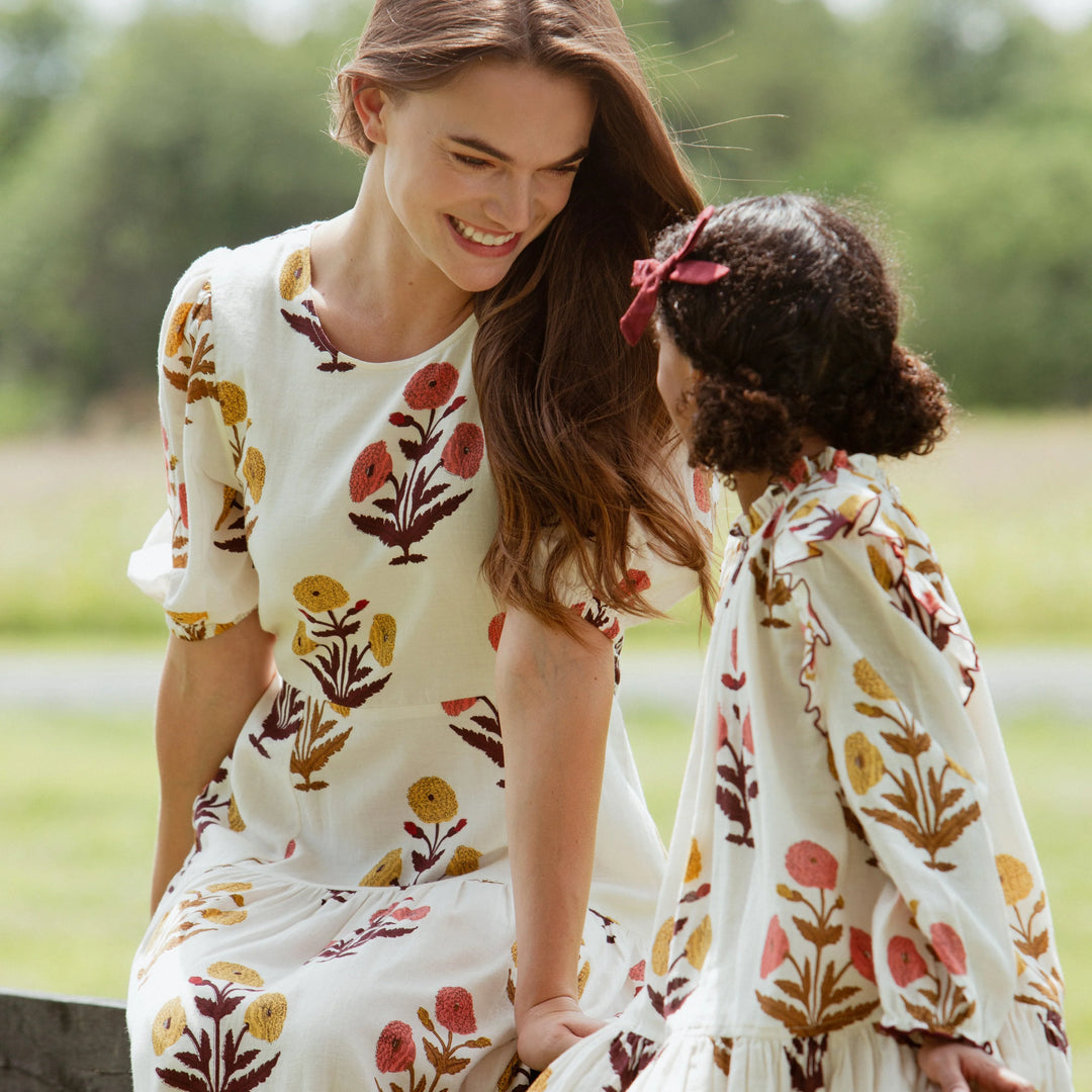 Girls Harvest Dandelion Dress styled with coordinating women’s floral dress for a mommy and me look