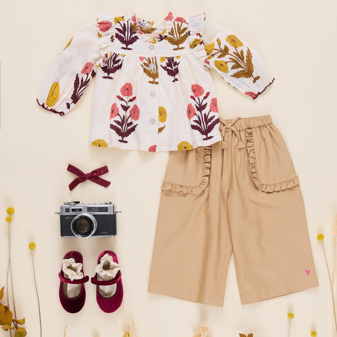 Girls Harvest Dandelion Top styled with tan pants, burgundy shoes and fall accessories