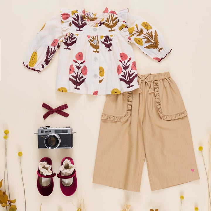 Girls Harvest Dandelion Top styled with tan pants, burgundy shoes and fall accessories