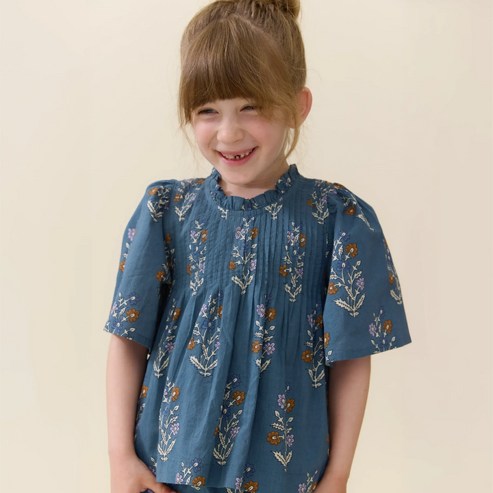 Girl modeling Girls Jaipur Top Balsam Dewdrop blue floral short sleeve top