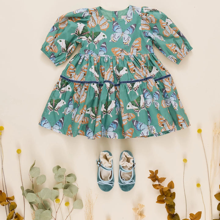 Girls Maribelle Dress Green Butterflies styled with blue velvet shoes for a fall outfit