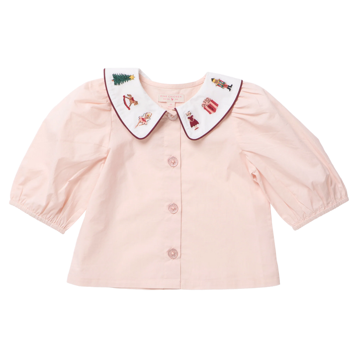 Pink Chicken Girls Noelle Top in blush pink featuring puff sleeves, sparkling buttons, and a white Nutcracker embroidered Peter Pan collar.
