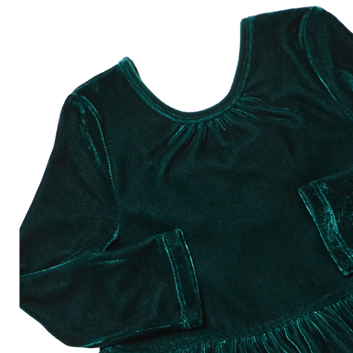 Close-up of Girls Pearl Dress showing luxurious evergreen velour fabric, gathered round neckline, and long sleeves