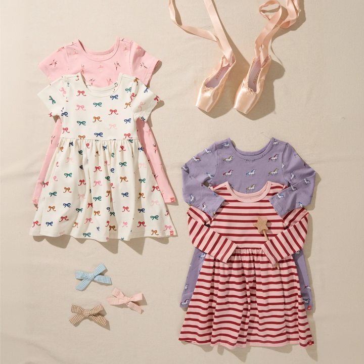 Girls pink and red striped long sleeve dress displayed with coordinating printed girls dresses, ballet slippers, and hair bows.