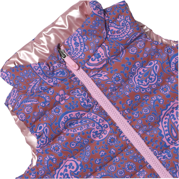 Close-up of Girls Reversible Riley Vest showing purple, pink, and blue paisley print and pink zipper