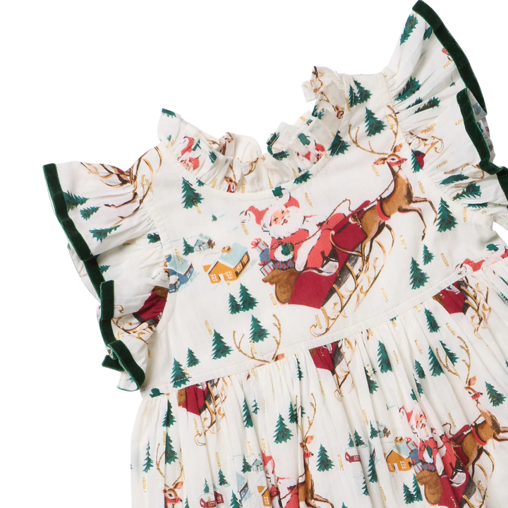Close-up of Pink Chicken Santa Sleigh Dress showing Santa and reindeer print, ruffled neckline, and green velvet-trimmed sleeves