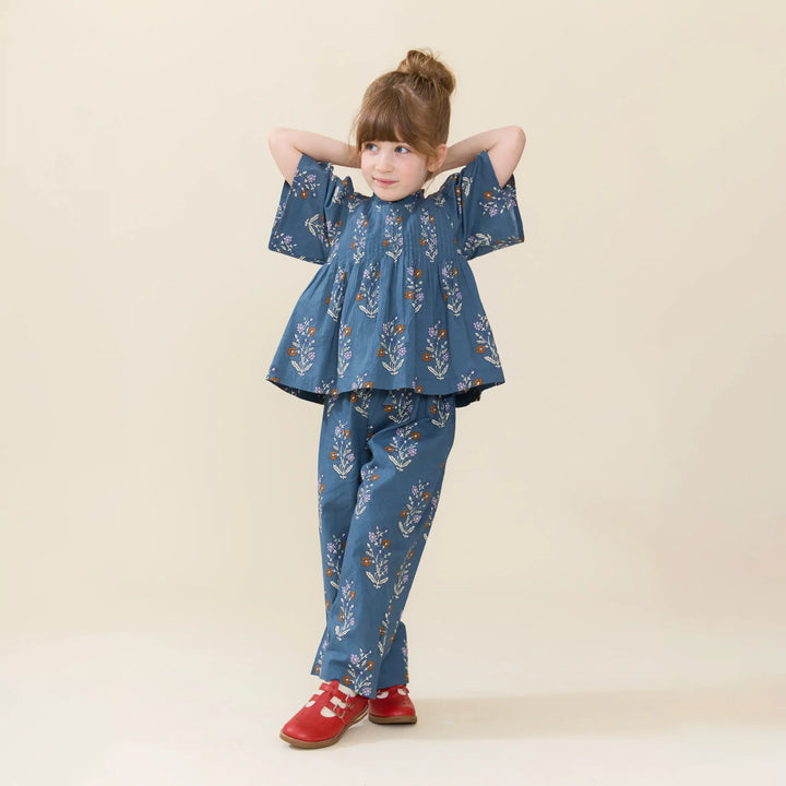 Girl wearing Girls Theodore Pant in Balsam Dewdrop with coordinating blue floral top