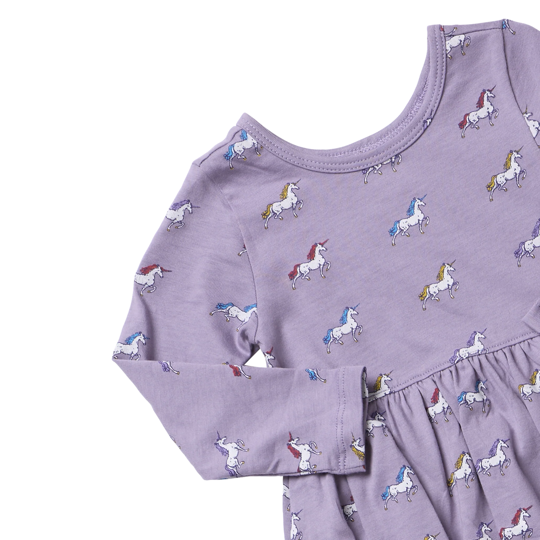 Close-up of Girls Unicorn Dress in lavender showing colorful unicorn print, round neckline and long sleeves