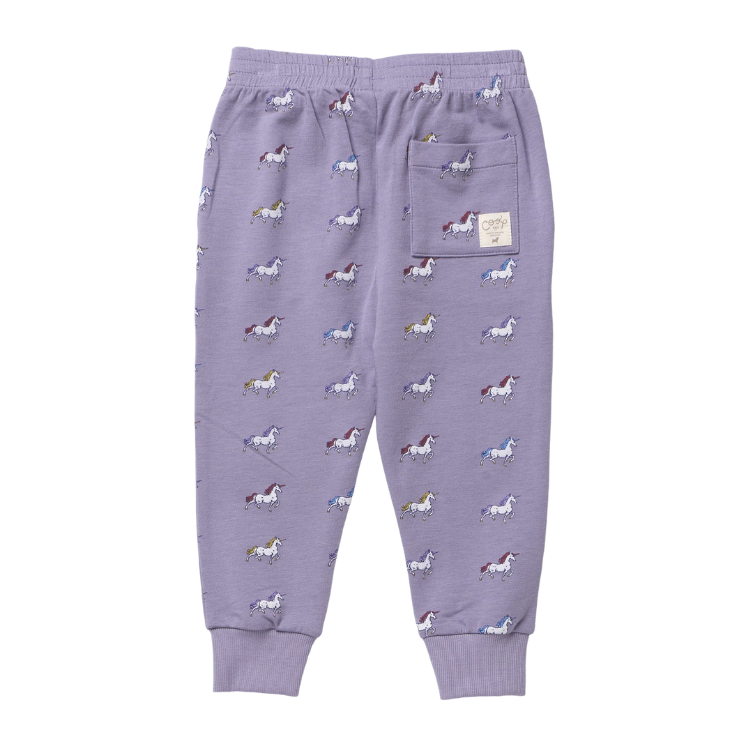 Back view of girls lavender unicorn jogger pants featuring colorful unicorn print, back patch pocket and ribbed cuffs