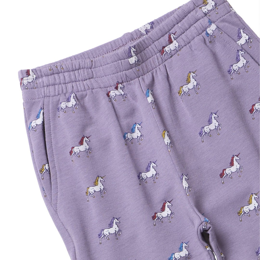 Close-up of girls lavender unicorn jogger pants showing colorful unicorn print, elastic waistband and side pocket