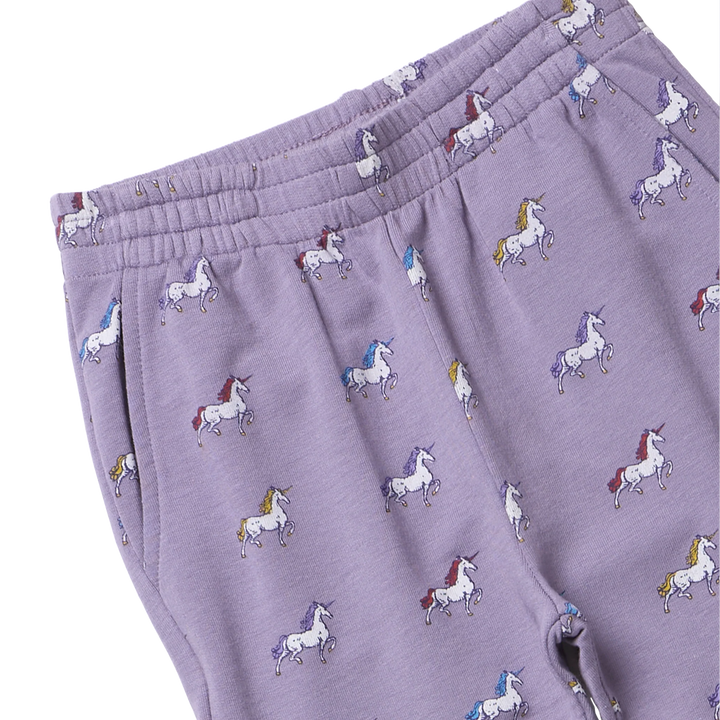 Close-up of girls lavender unicorn jogger pants showing colorful unicorn print, elastic waistband and side pocket