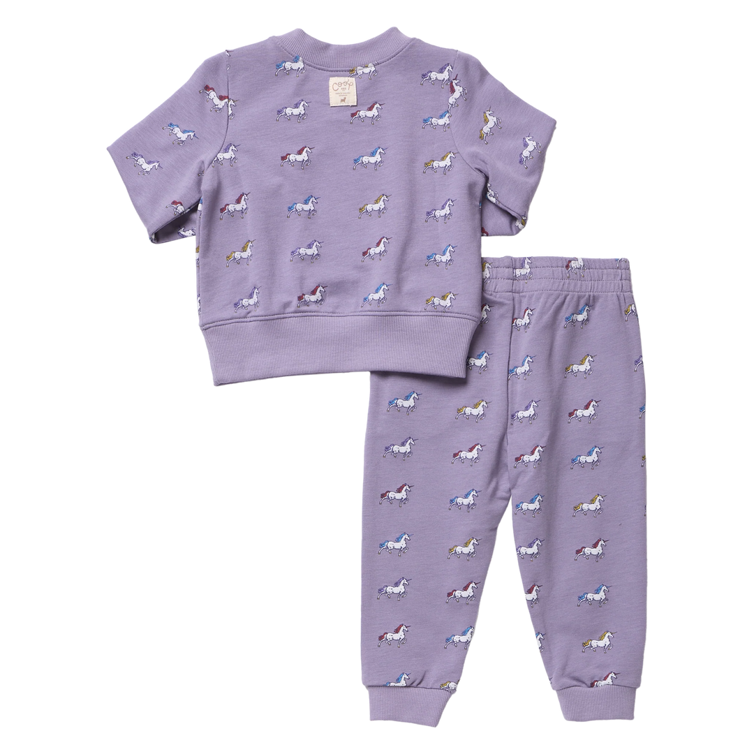 Back view of girls purple unicorn jogger set featuring a short sleeve sweatshirt and matching pants with colorful allover unicorn print.