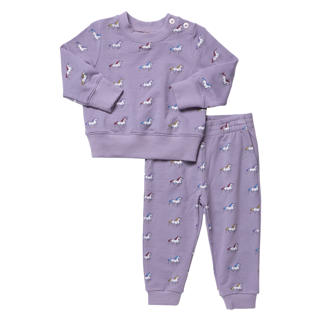 Girls purple unicorn jogger set featuring a long sleeve sweatshirt with shoulder buttons and matching unicorn print jogger pants.