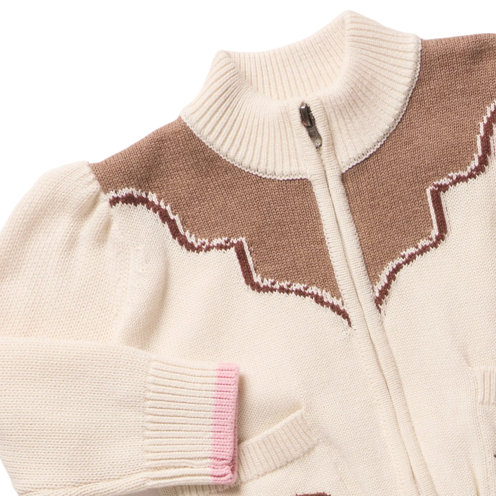 Close-up of Girls Western Sweater featuring brown western yoke design, ribbed collar and pink cuff trim