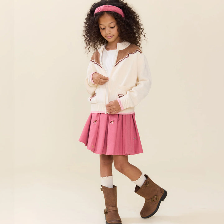Girl wearing Girls Western Sweater in cream and brown with pink horse embroidered skirt and boots