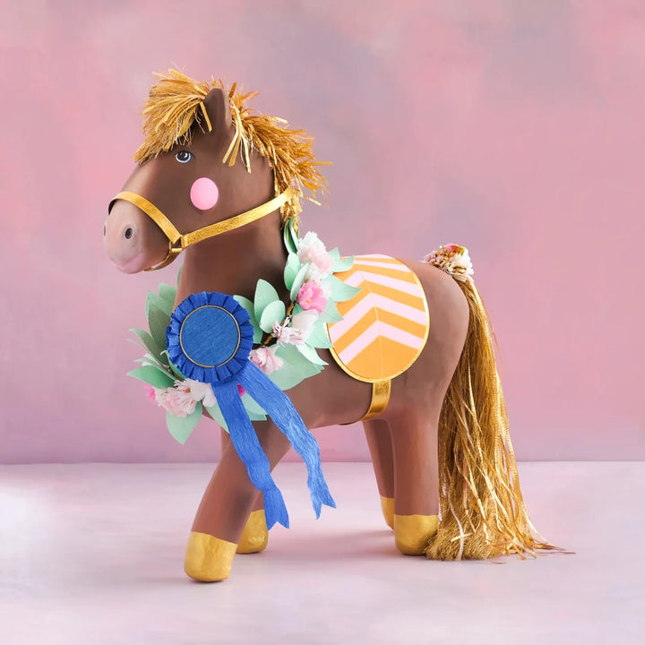 Glitterville Gallop the Horse Display, a brown decorative horse with gold mane and tail, floral garland, blue ribbon, and pink and yellow saddle.