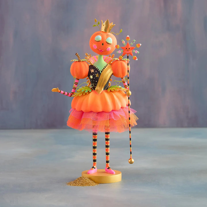 Glitterville Fairy Gourdmother Halloween tabletop decoration featuring a pumpkin fairy with a gold crown, pink and orange tulle skirt, pumpkins, and candy-striped wand.