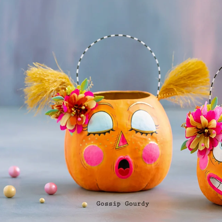 Glitterville Gossip Gourdy pumpkin buckets featuring a playful face, colorful floral accents, and whimsical Halloween details.