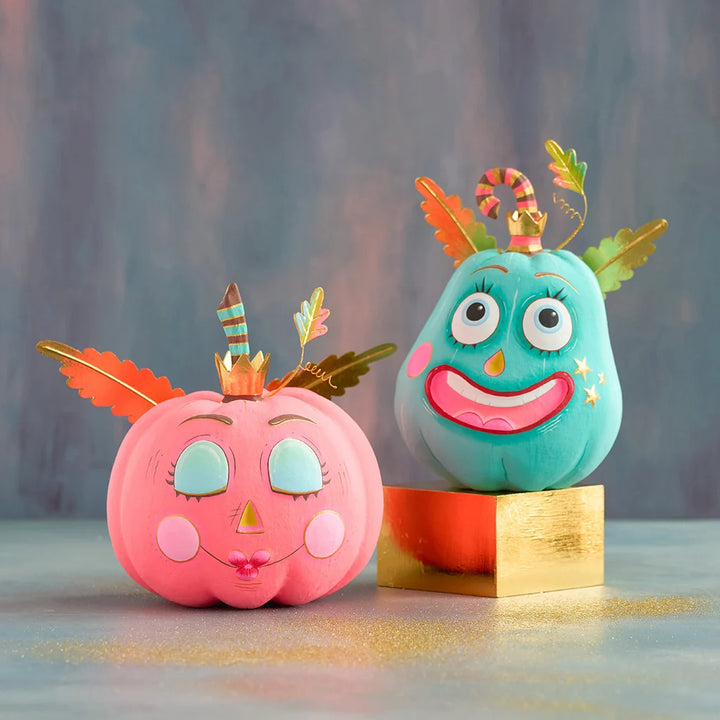 Glitterville Gourdy and Gurdie Pumpkin Pixies displayed together on a gold pedestal