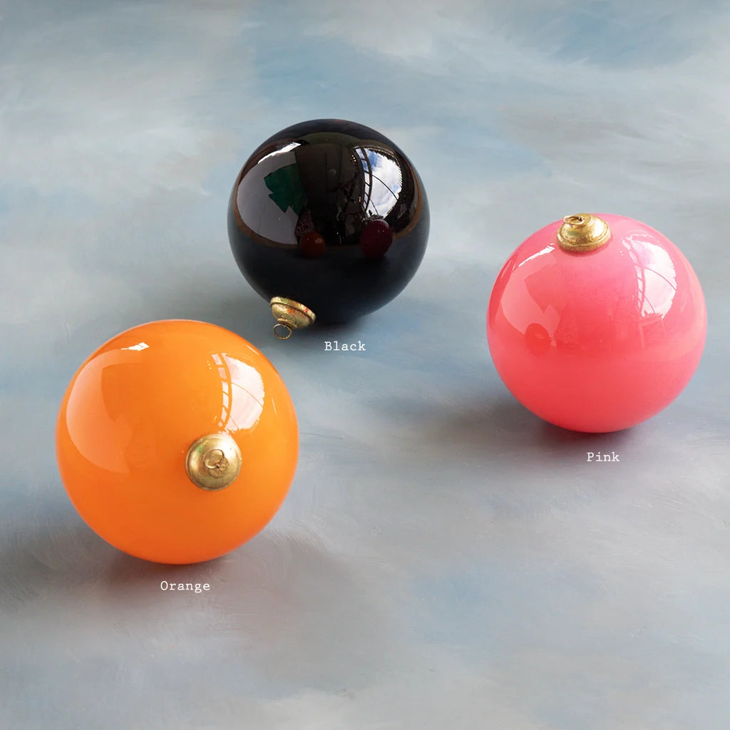 Glitterville Halloween ball large ornament set featuring glossy pink, orange, and black round ornaments with metallic gold caps, perfect for creating a colorful, playful Halloween tree or festive seasonal display. Colors are labeled near each ornament for easy distinguishing. 