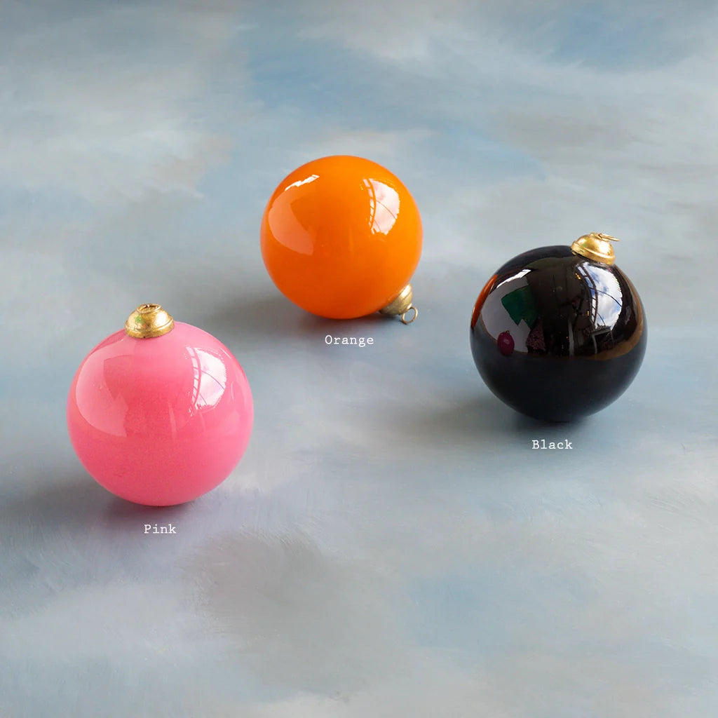 Glitterville Halloween ball small ornament set featuring glossy pink, orange, and black round ornaments with metallic gold caps, perfect for creating a colorful, playful Halloween tree or festive seasonal display. Colors are labeled near each ornament for easy distinguishing. 