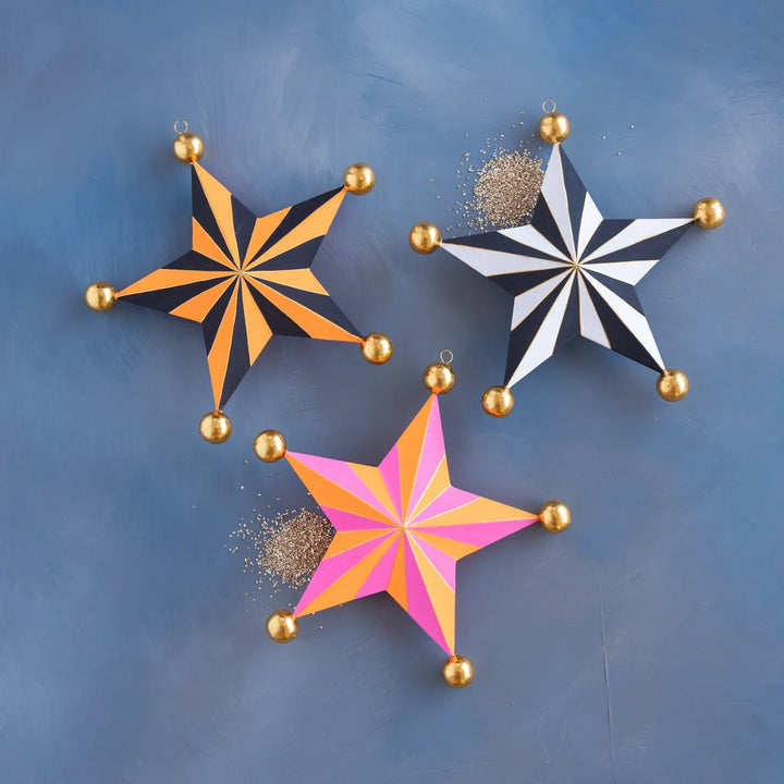Glitterville Halloween Stripe Star Set small size featuring orange and black, black and white, and pink and orange striped stars with gold ball accents.