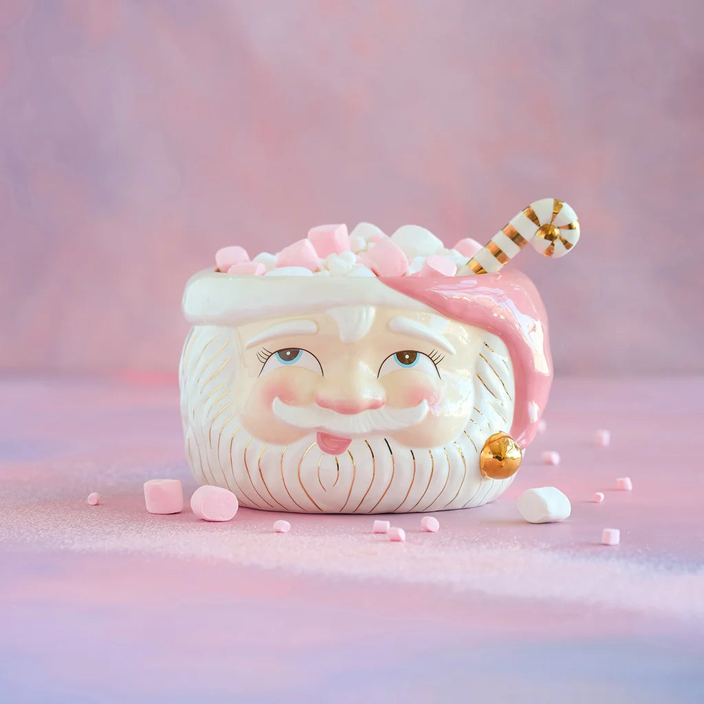 Glitterville Papa Noel pink ceramic Santa Claus punch bowl with a pink hat, white and gold detailing, pastel marshmallows, and a white and gold striped ladle.