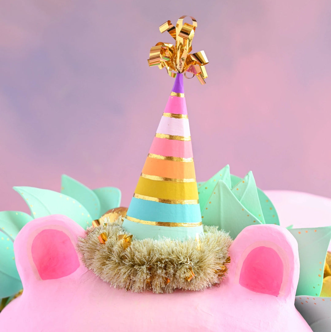 Close up image of the party hat worn by Glitterville&