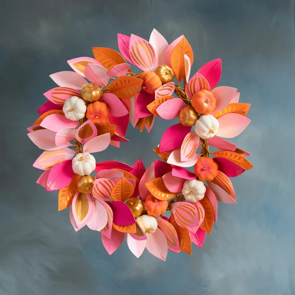 Glitterville pink pumpkin patch wreath featuring layered pink and orange leaves, mini orange and white pumpkins, and gold accents.