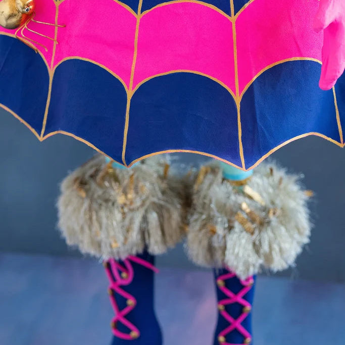 Close-up detail of Glitterville Pinky Itchy Witchy showing the bottom of her spiderweb style dress skirt, and the top of her fur boots. 