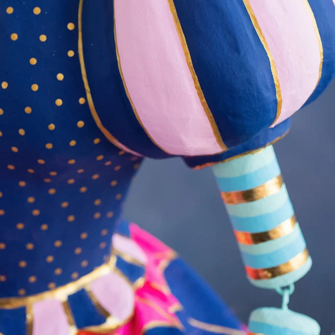Close-up detail of Glitterville Pinky Itchy Witchy showing striped puff sleeve, and the beginning of her stripped detailed arm. 