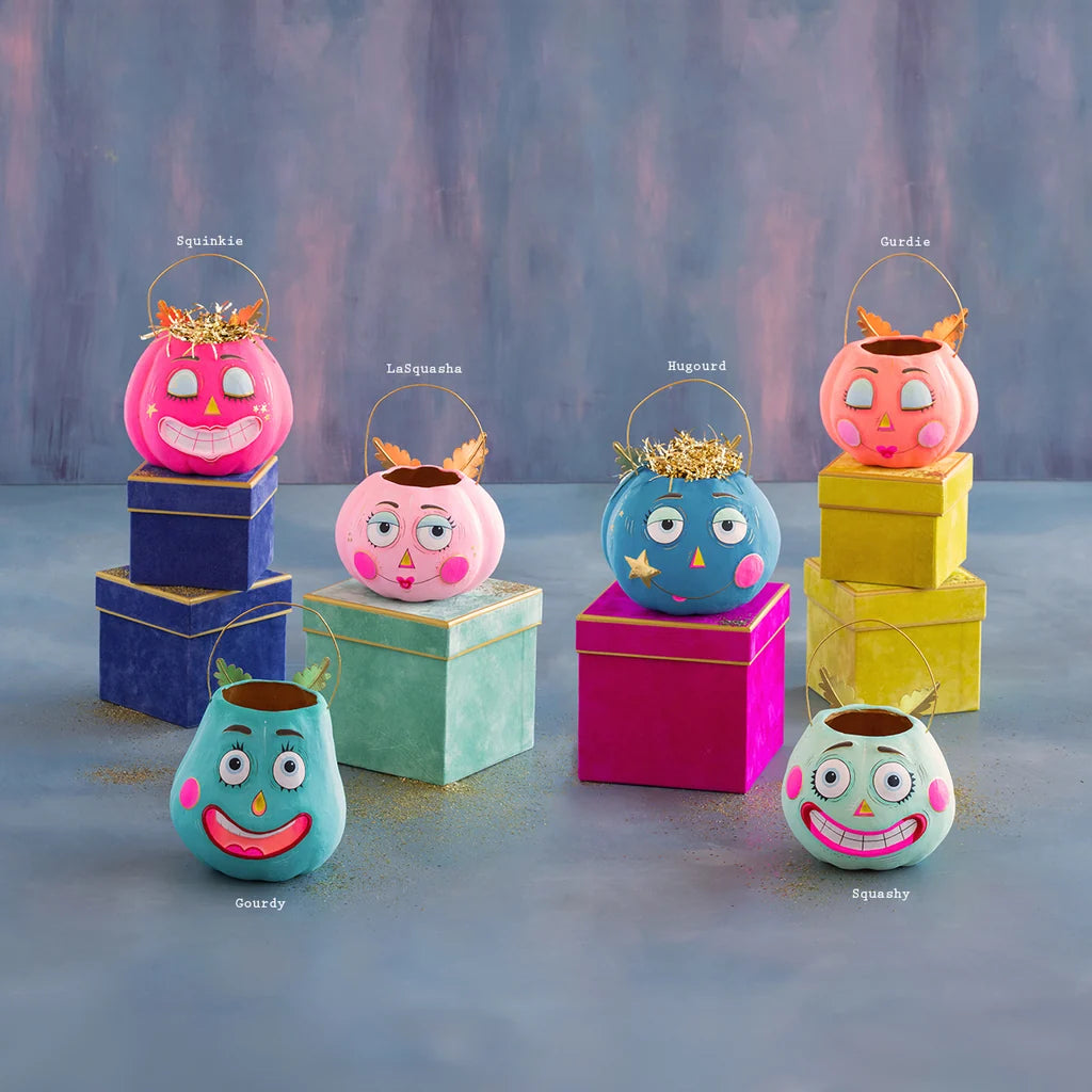 Glitterville Pumpkin Pixie Buckets collection with name labels, featuring Squinkie, LaSquasha, Hugourd, Gurdie, Gourdy, and Squashy in colorful pumpkin designs.
