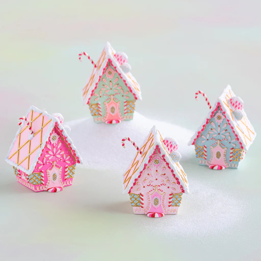 Glitterville rainbow gingerbread cottage Christmas ornaments displayed together in mint, hot pink, pink, and blue, featuring intricate pink, white, and gold icing, candy-cane accents, peppermint details, gold lattice designs, decorative doors, snowy white roof trim, and whimsical pastel gingerbread house designs for a colorful holiday display.