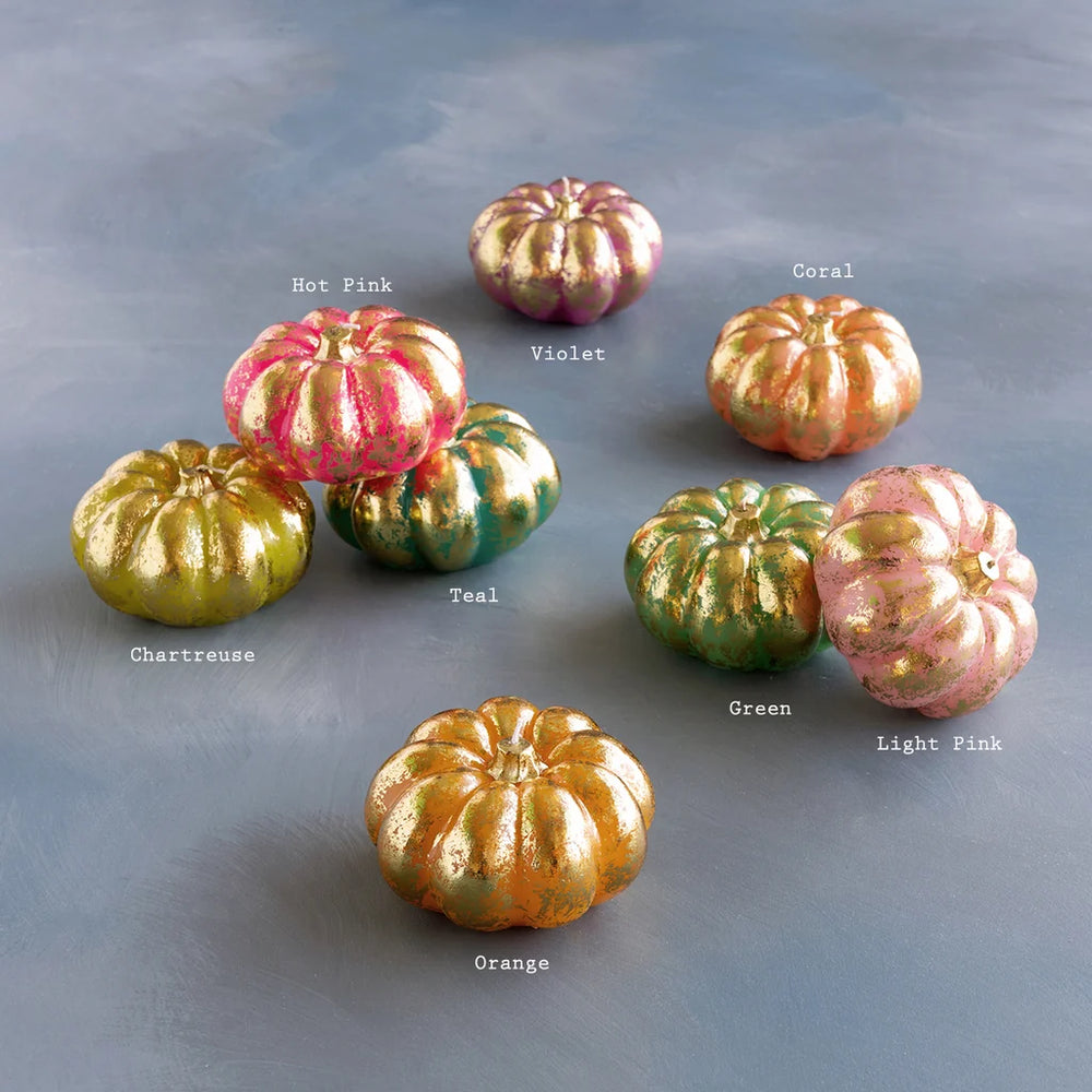 Glitterville Rainbow Pumpkin Candle Set featuring colorful pumpkin-shaped candles with shimmering gold accents in pink, green, yellow, orange, and purple. Color labels are displayed near each candle for easy distinguishing. 