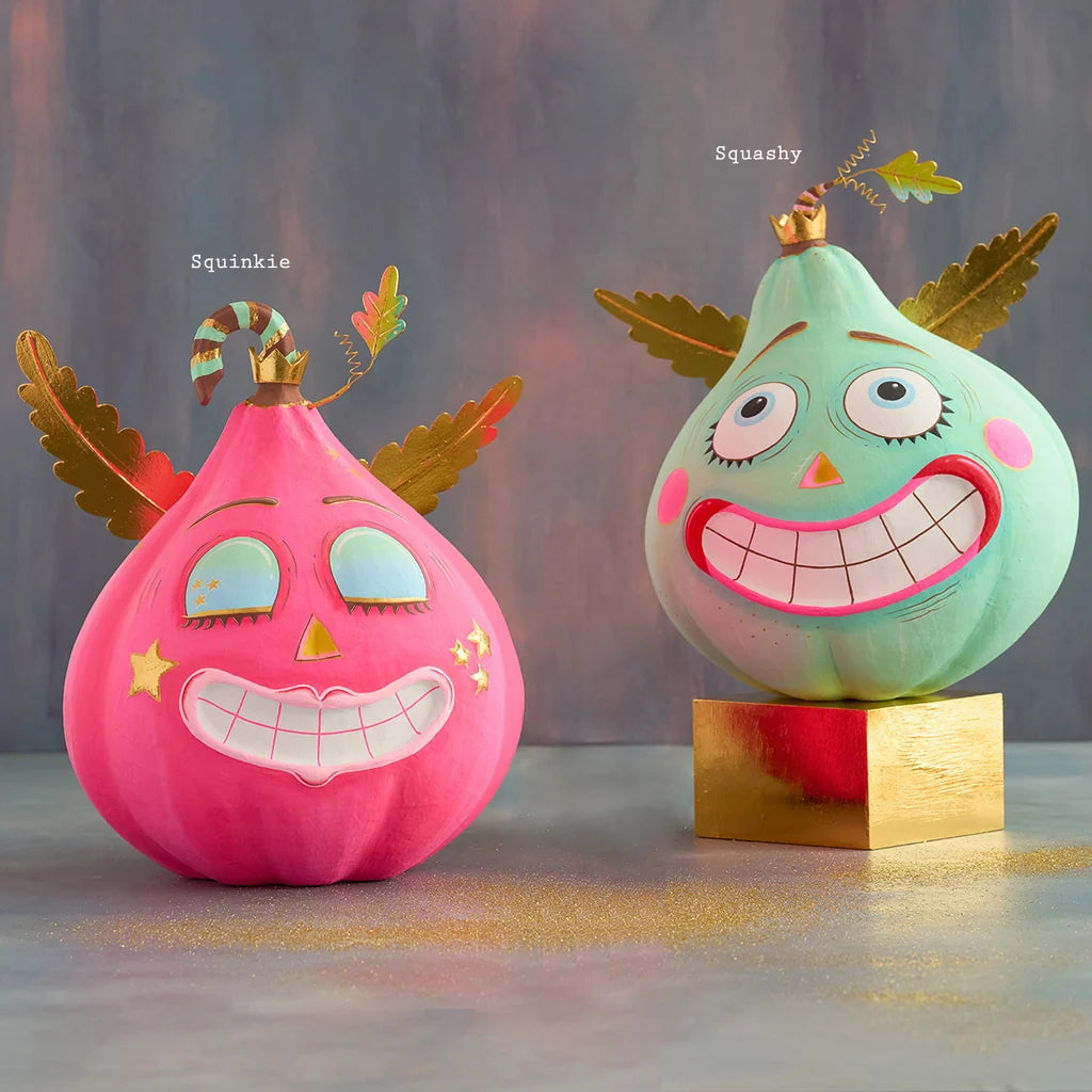 Glitterville Squashy and Squinkie Pumpkin Pixies displayed together with their names labeled above each 