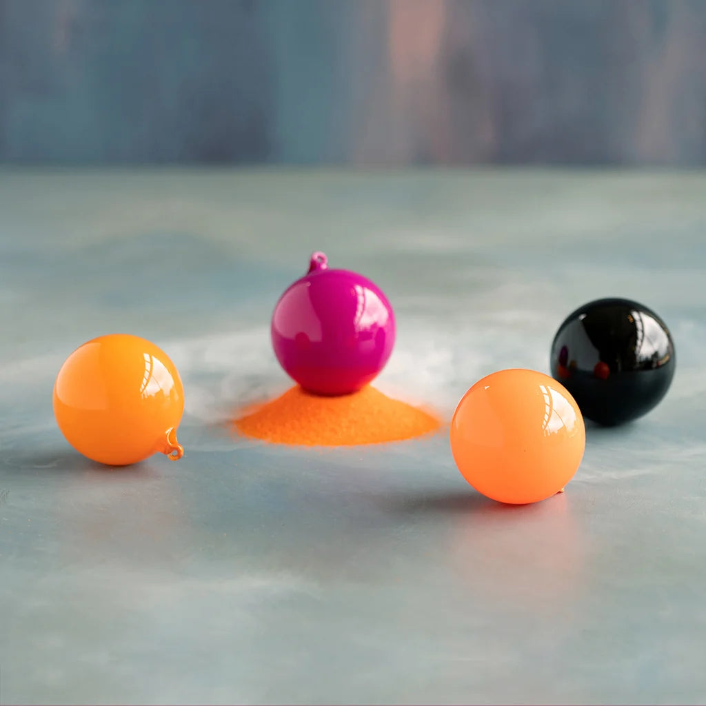 Glitterville Trick or Sweet Halloween ball ornament set featuring glossy hot pink, bright orange, and classic black ornaments, creating a playful and colorful look for Halloween trees, garlands, wreaths, and festive seasonal decorating.