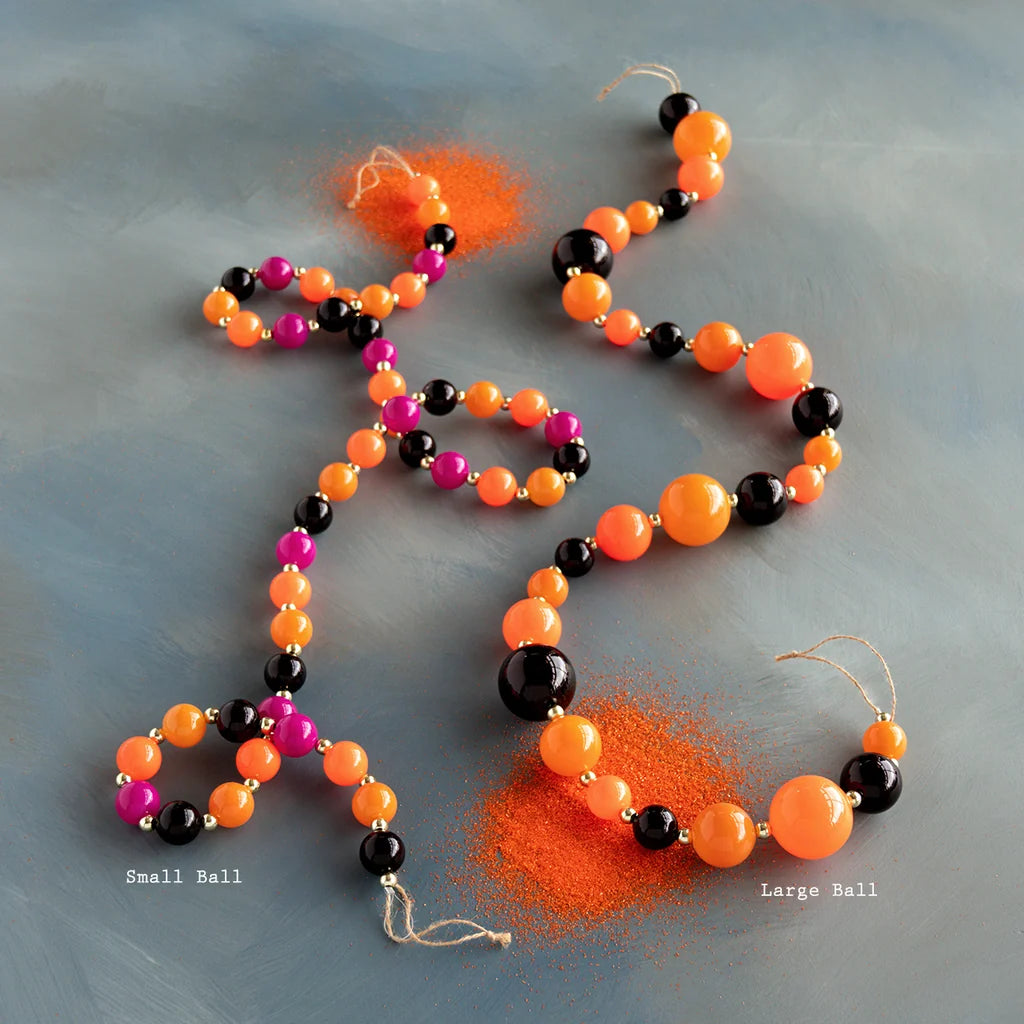 Glitterville Trick or Sweet Halloween beaded garland set featuring vibrant orange, black, and hot pink beads, creating a playful candy-inspired look for Halloween trees, mantels, shelves, party tables, and festive seasonal decorating. Ball size labeled under each garland for easy distinguishing. 