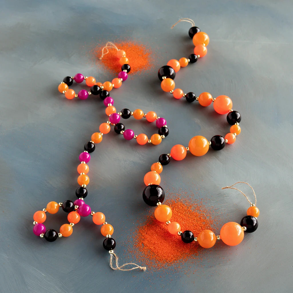 Glitterville Trick or Sweet Halloween beaded garland set featuring vibrant orange, black, and hot pink beads, creating a playful candy-inspired look for Halloween trees, mantels, shelves, party tables, and festive seasonal decorating.
