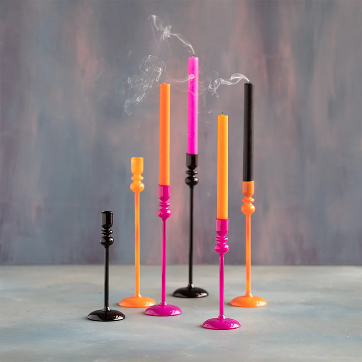 Glitterville Trick or Sweet Halloween taper candles featuring colorful pink, orange, and black candle holders with coordinating taper candles, perfect for festive Halloween table décor.
