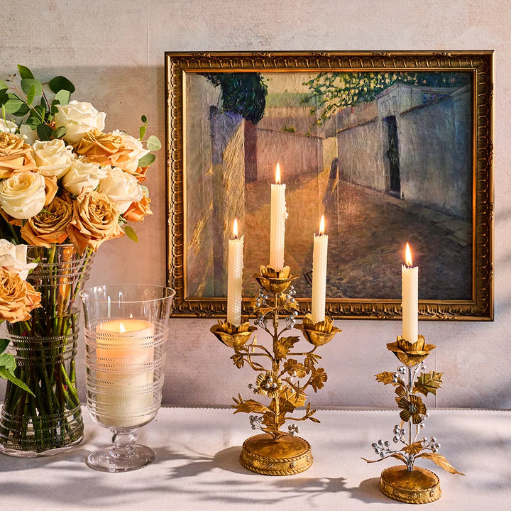 Gold Holly 3-Light Candelabra displayed with coordinating gold candle holders, flowers and elegant holiday décor