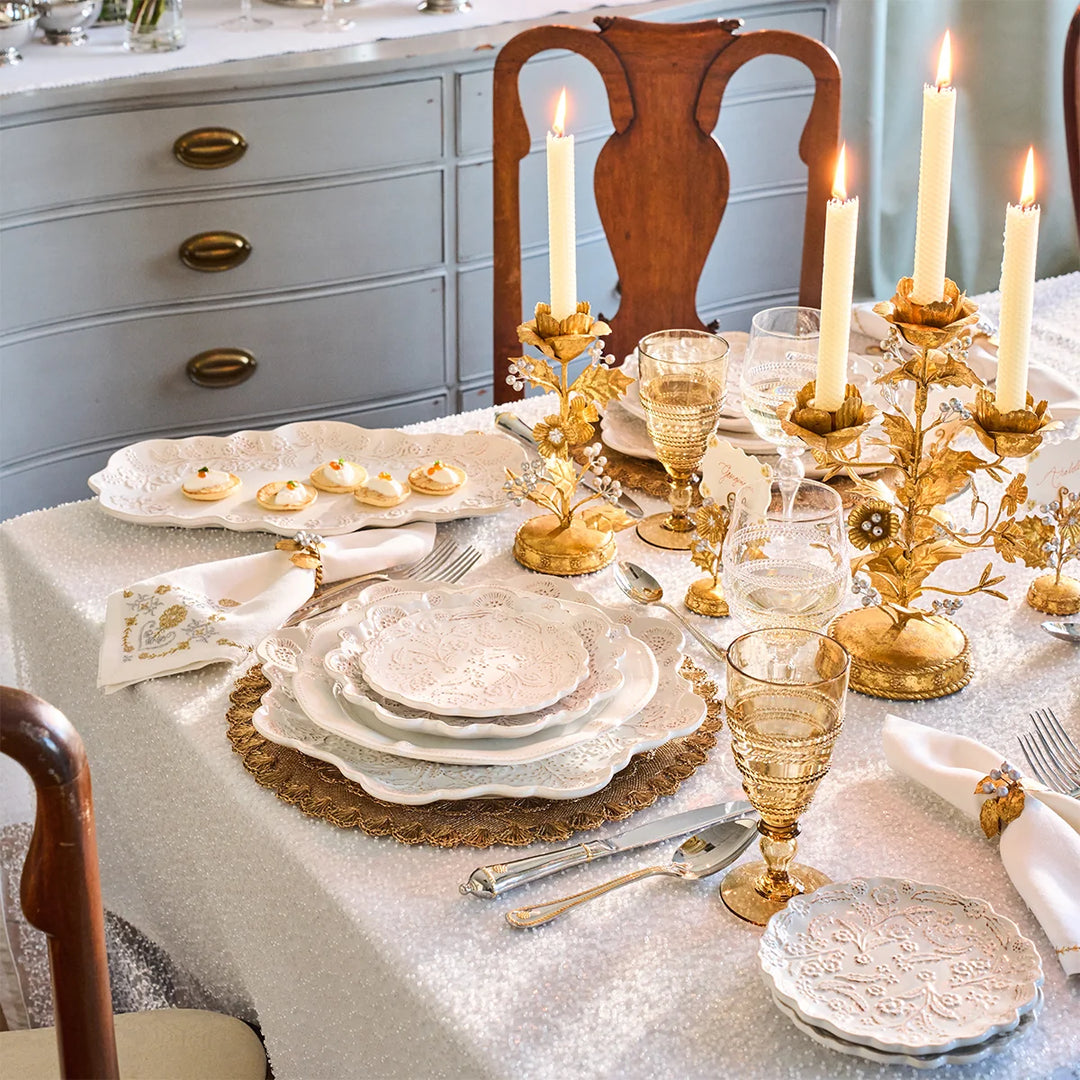 Gold Holly 3-Light Candelabra styled as an elegant Christmas table centerpiece with white dinnerware and gold accents
